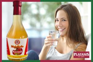 Woman enjoying diluted apple cider vinegar for its health benefits